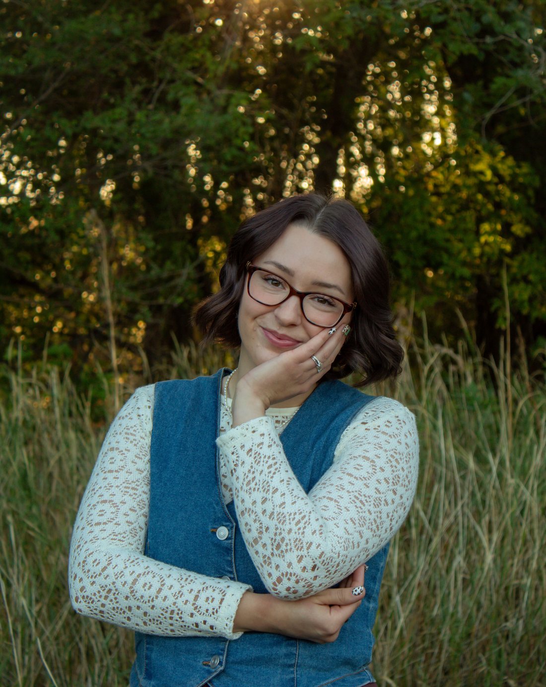 Portrait of Lynea Millward in a field at golden hour